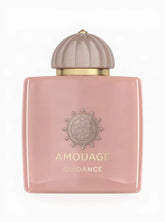 Pink Amouage perfume bottle with a gold cap on a white background